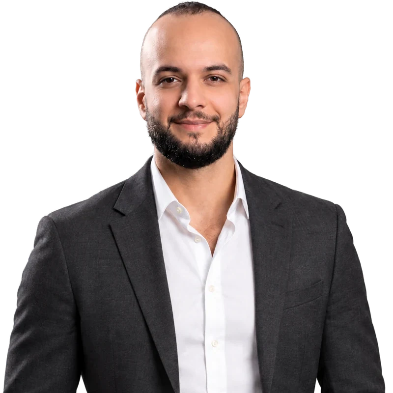 Majd Othman in a charcoal suit and white shirt